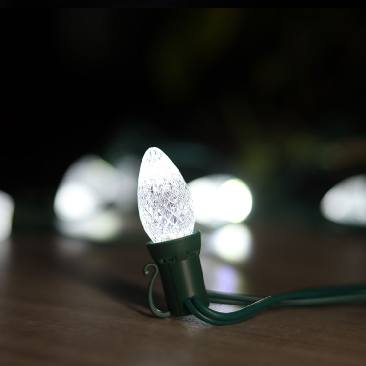 Commercial grade holiday lighting installation showing color temperature differences